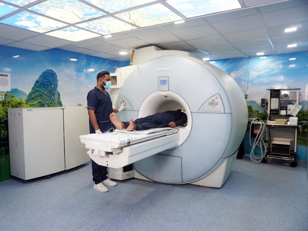 Mastering the First Impression: Your intriguing post title goes here A medical technician assists a patient in an MRI machine in a healthcare facility, showcasing modern medical technology.